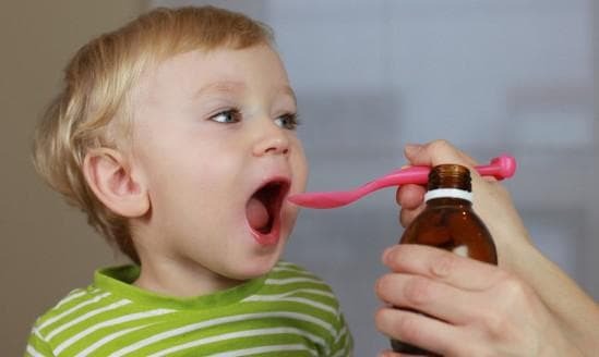taking a syrup by a child