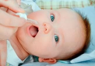 instillation of drops into the nose of babies